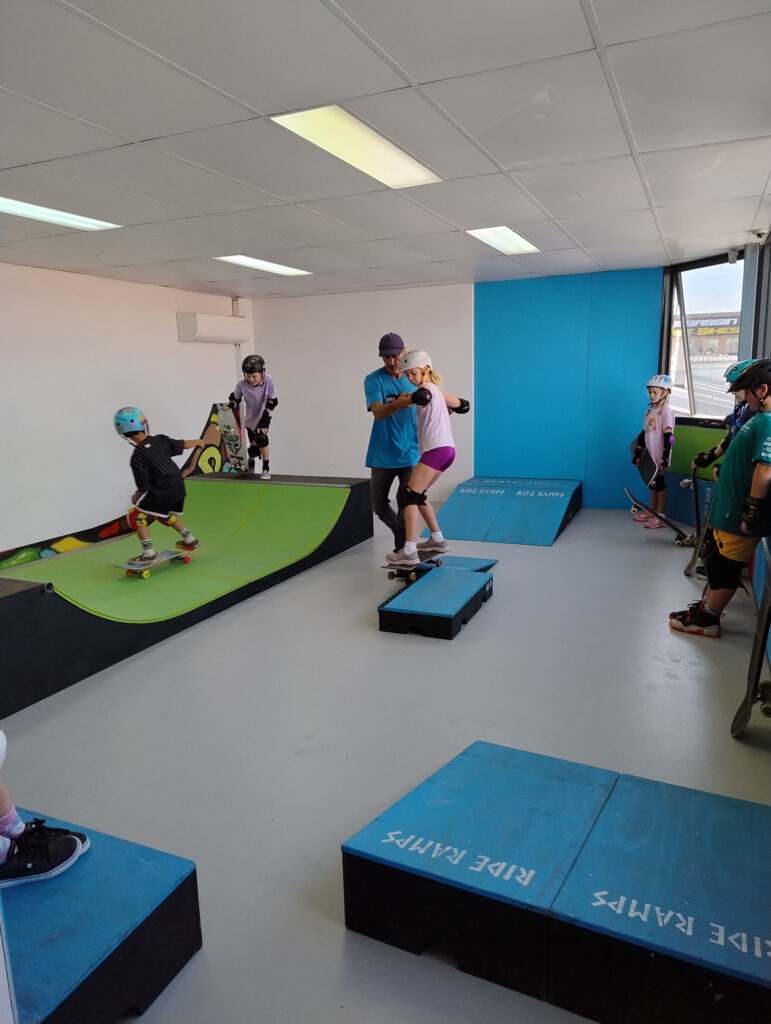 Coach-Helps-Skater-Skate-Ramps