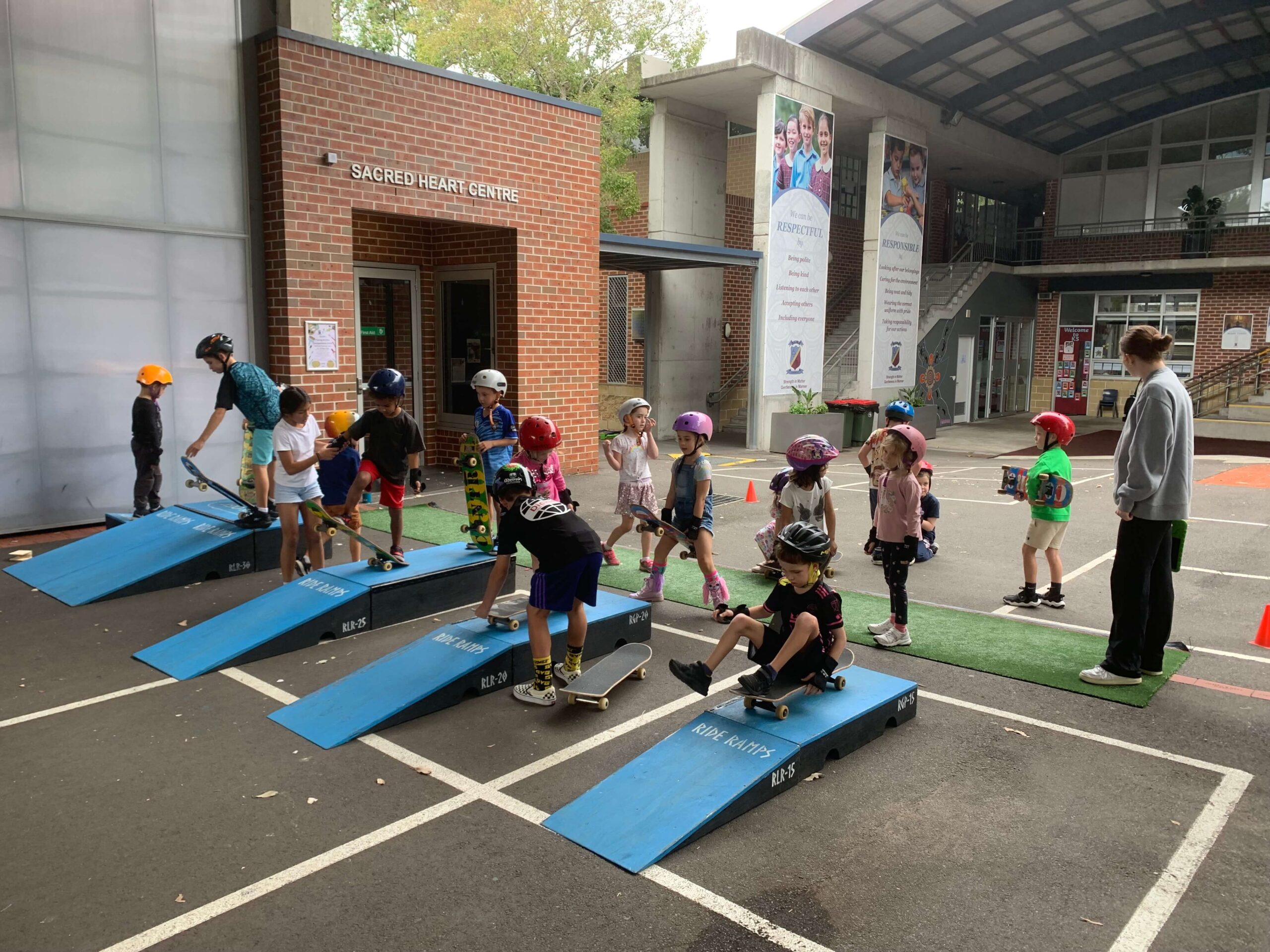 Kids having fun on skateboards & skate ramps.