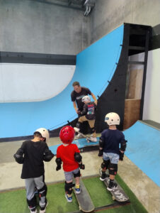 Skate coach with kids.