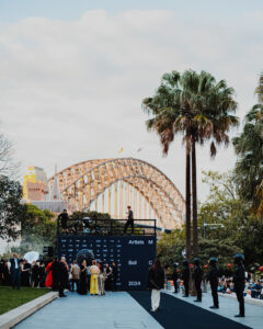 Harbour bridge behind vert skate ramp.